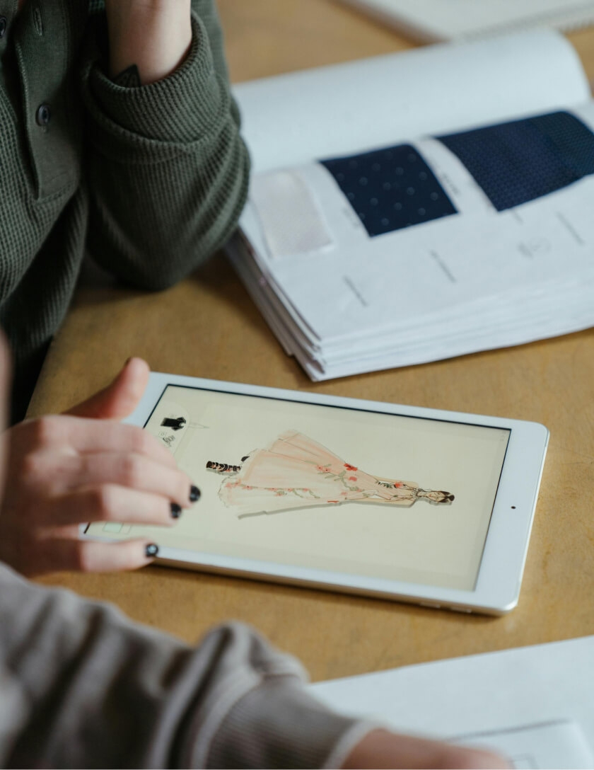 Photo of the women viewing the webpages on the tablet